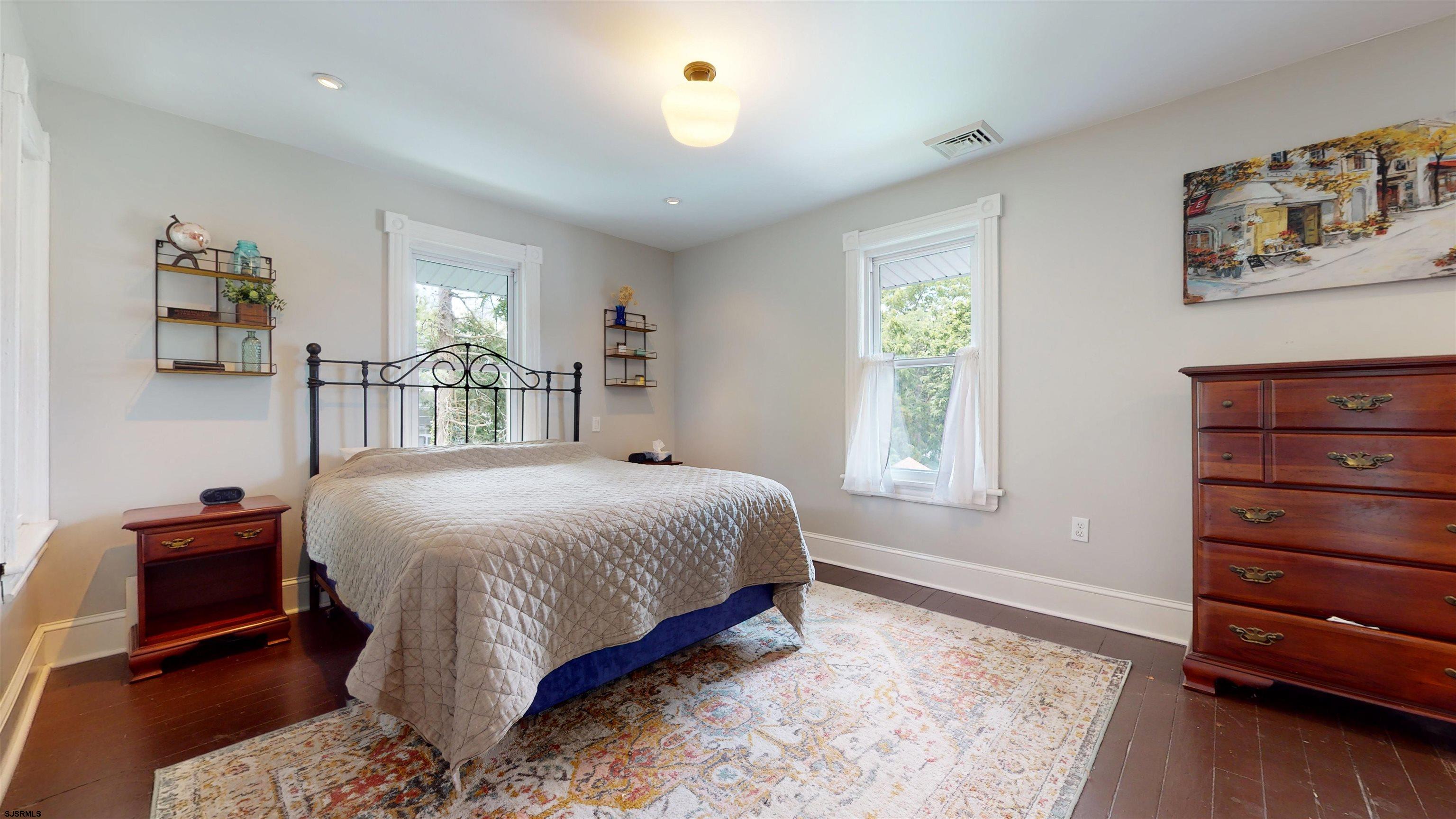 1409 Shore Road Northfield, NJ 08225 - Photo 32 of 50 a bedroom with a bed and a dresser