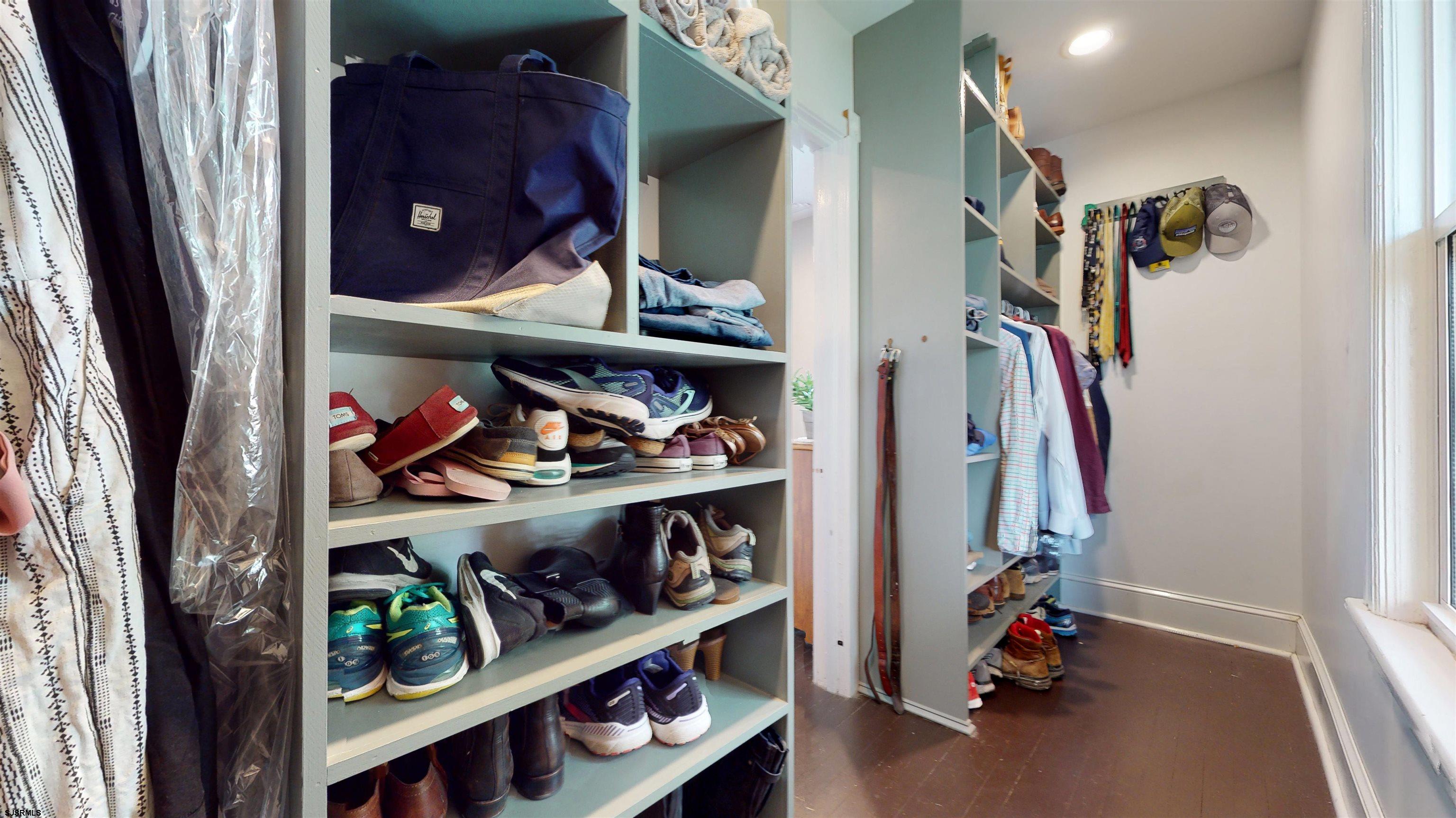1409 Shore Road Northfield, NJ 08225 - Photo 34 of 50 a view of walk in closet with clothes and shoes