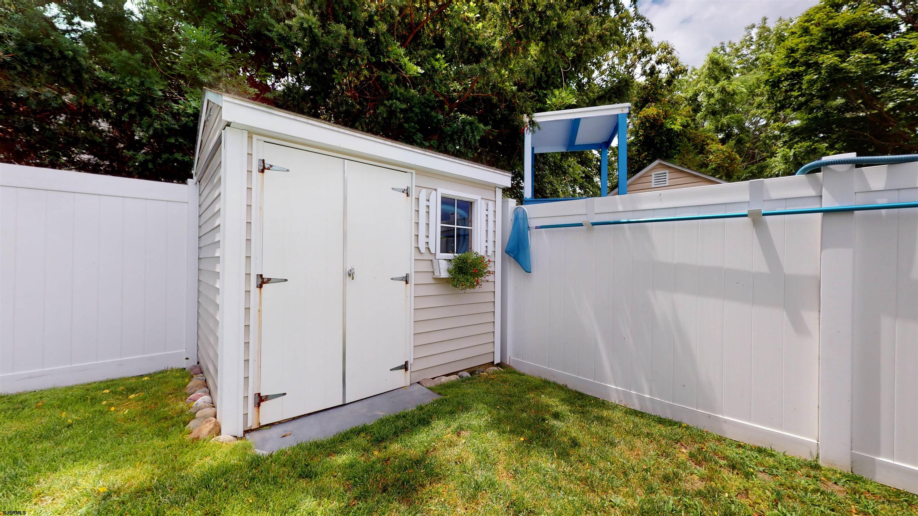 1409 Shore Road Northfield, NJ 08225 - Photo 45 of 50 a view of a house with backyard and garden