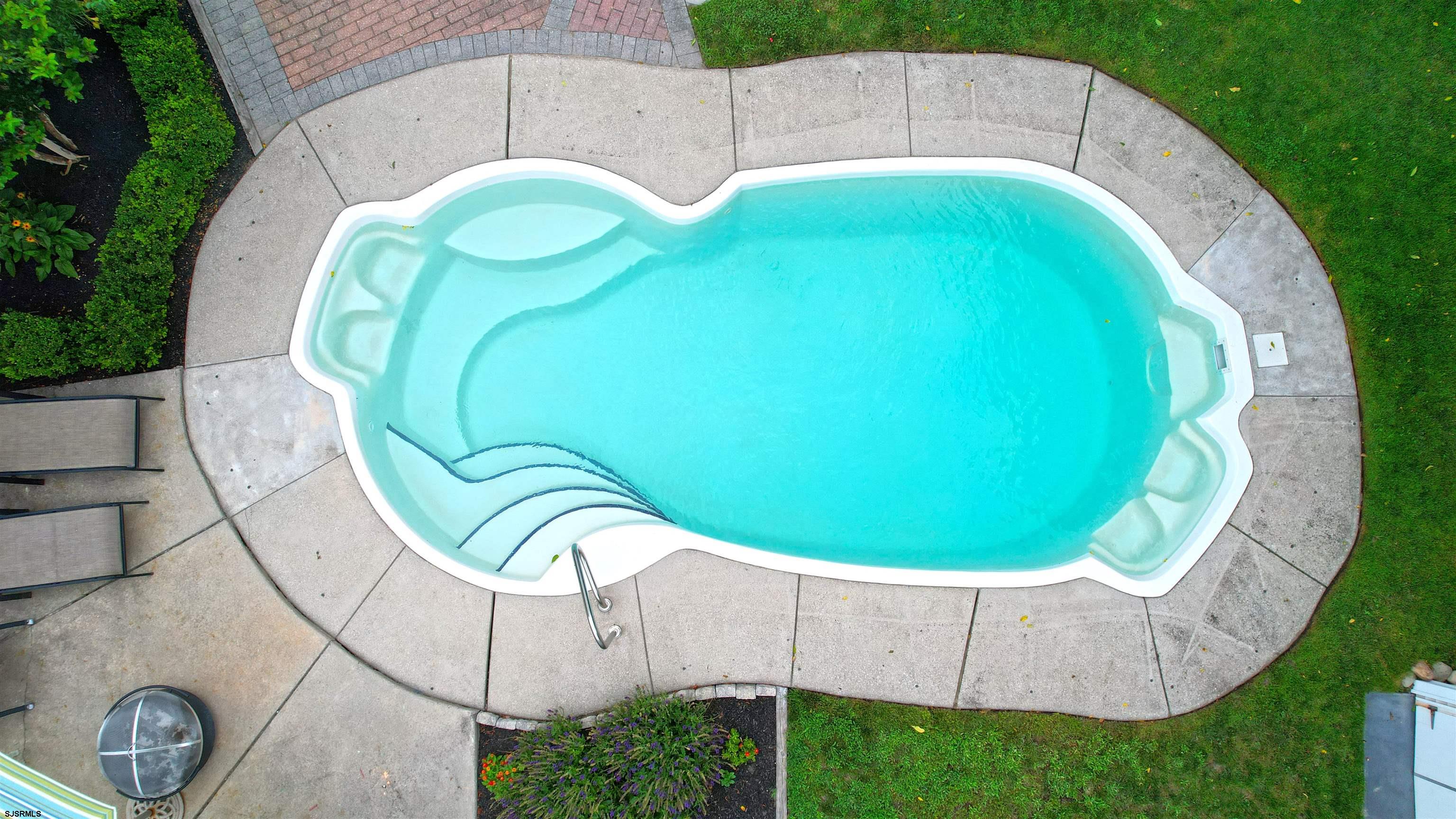 1409 Shore Road Northfield, NJ 08225 - Photo 9 of 50 a view of a swimming pool with a backyard