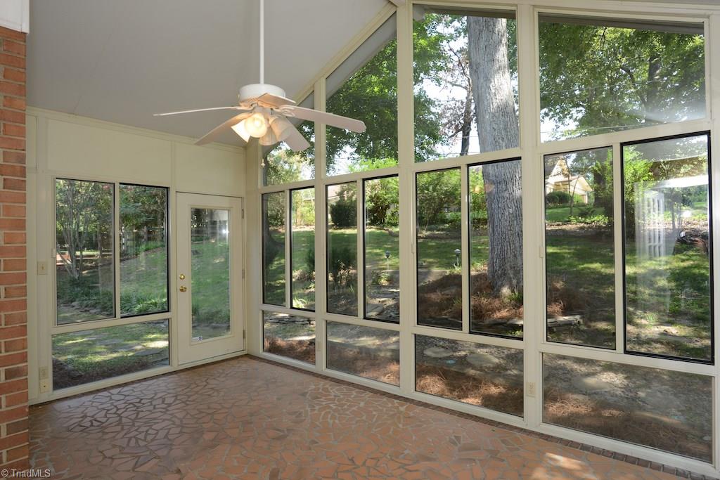 910 Wimbledon Place High Point, NC 27262 - Photo 15 of 30 Love this sun room with tile floor and sliding windows. Enjoy the AC or open it up for the fresh air.