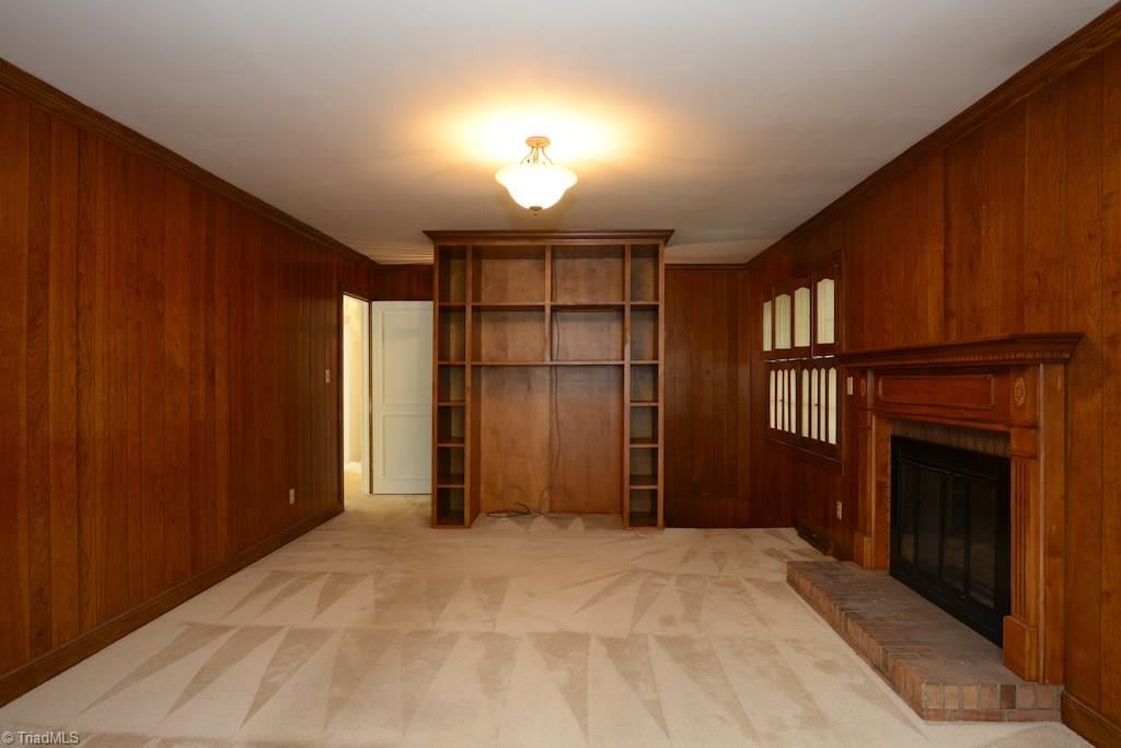 910 Wimbledon Place High Point, NC 27262 - Photo 18 of 30 What a cozy den...its spacious but paneling gives it a cozy feel..enjoy the gas log fireplace