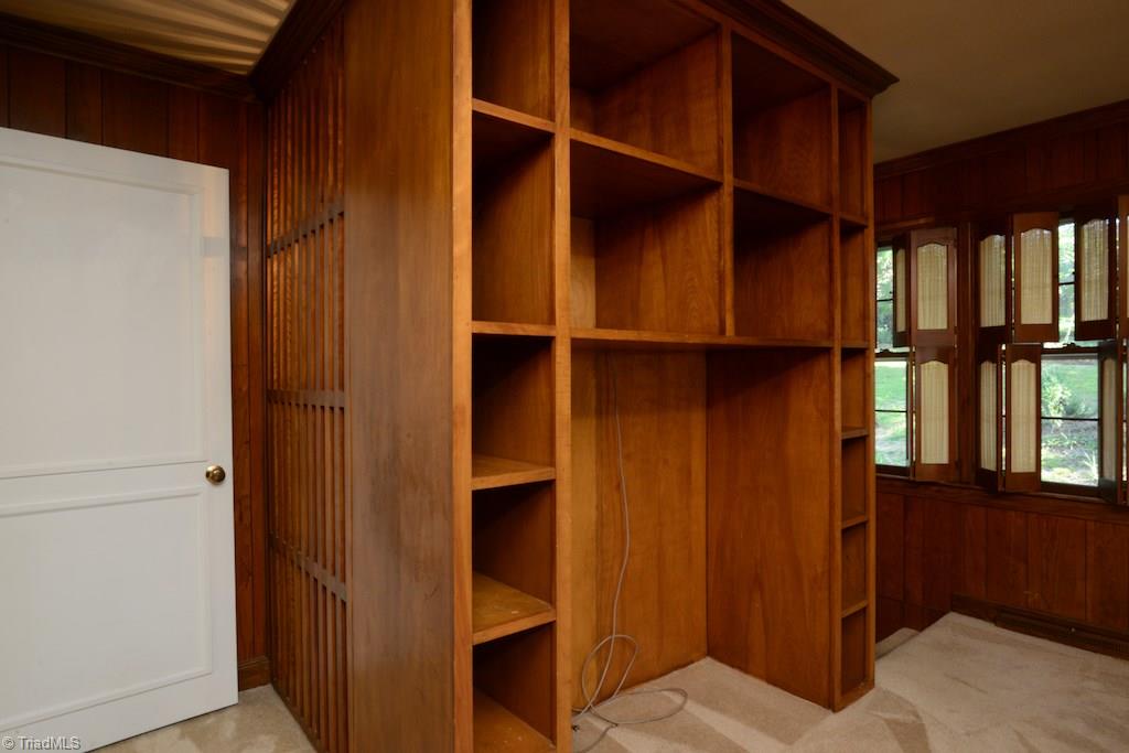 910 Wimbledon Place High Point, NC 27262 - Photo 20 of 30 Built in bookshelves create the stairwell to the finished basement