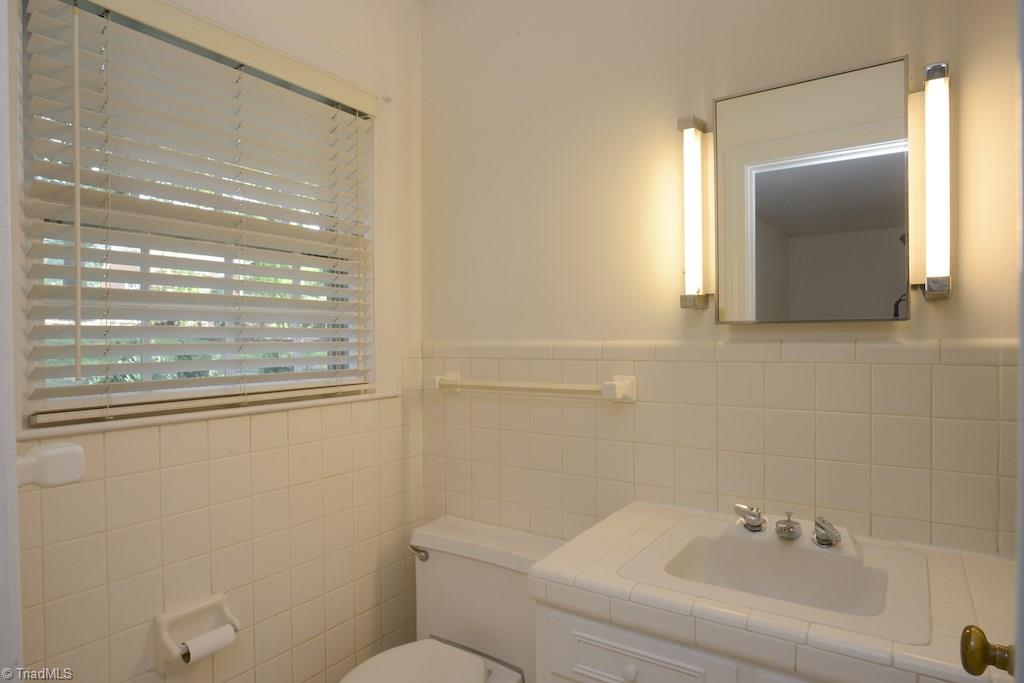 910 Wimbledon Place High Point, NC 27262 - Photo 22 of 30 White tile makes this bath a perfect palette for your personal touches