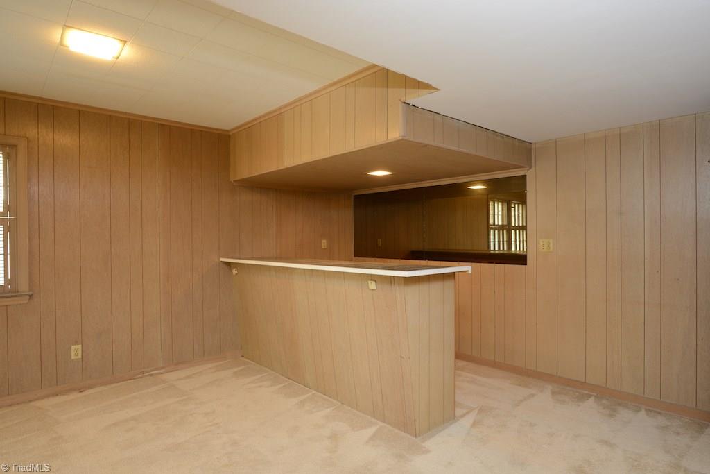 910 Wimbledon Place High Point, NC 27262 - Photo 29 of 30 Basement rec room with built in bar could be a great playroom or "mansland".
