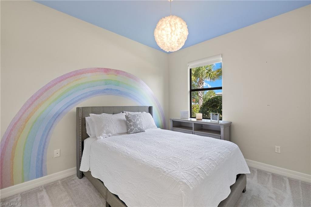 4424 Owens Way Ave Maria, FL 34142 - Photo 12 of 28 a bedroom with a bed and a window