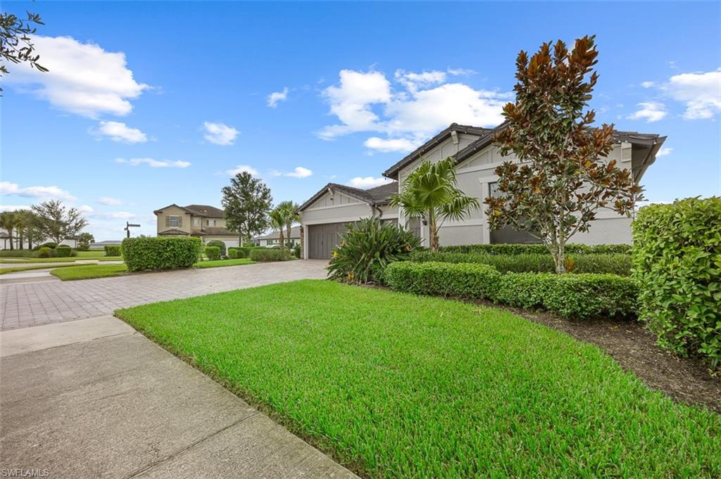 4424 Owens Way Ave Maria, FL 34142 - Photo 22 of 28 a view of a green field