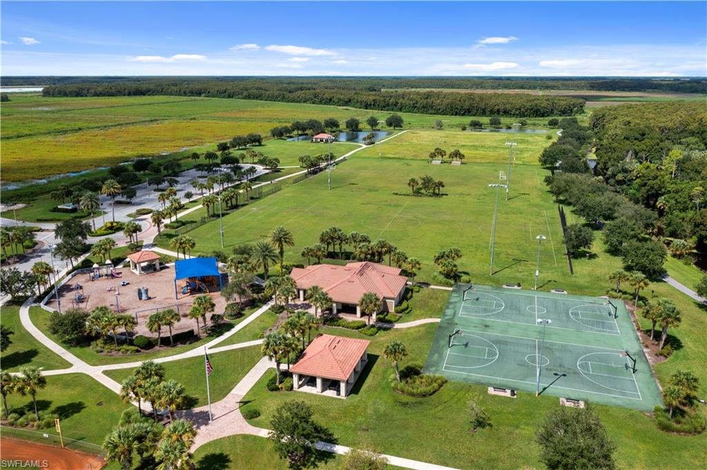 4424 Owens Way Ave Maria, FL 34142 - Photo 27 of 28 an aerial view of a house with a swimming pool outdoor seating and yard