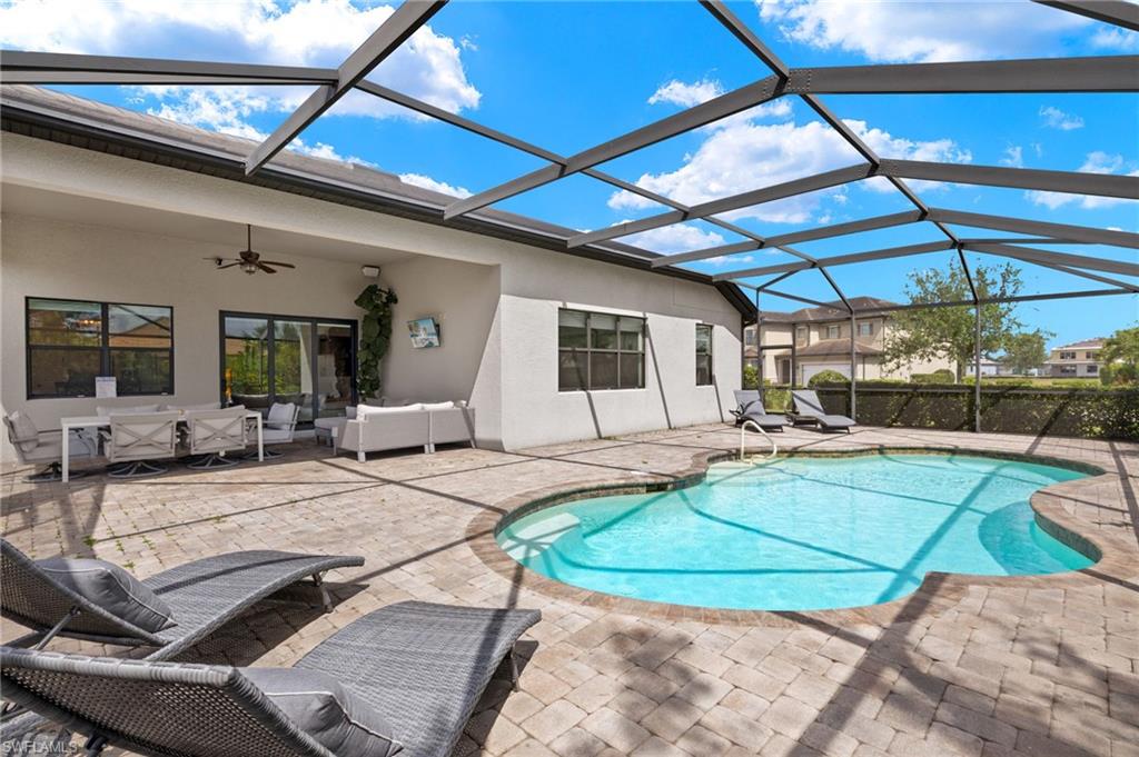 4424 Owens Way Ave Maria, FL 34142 - Photo 4 of 28 a view of a swimming pool with a patio