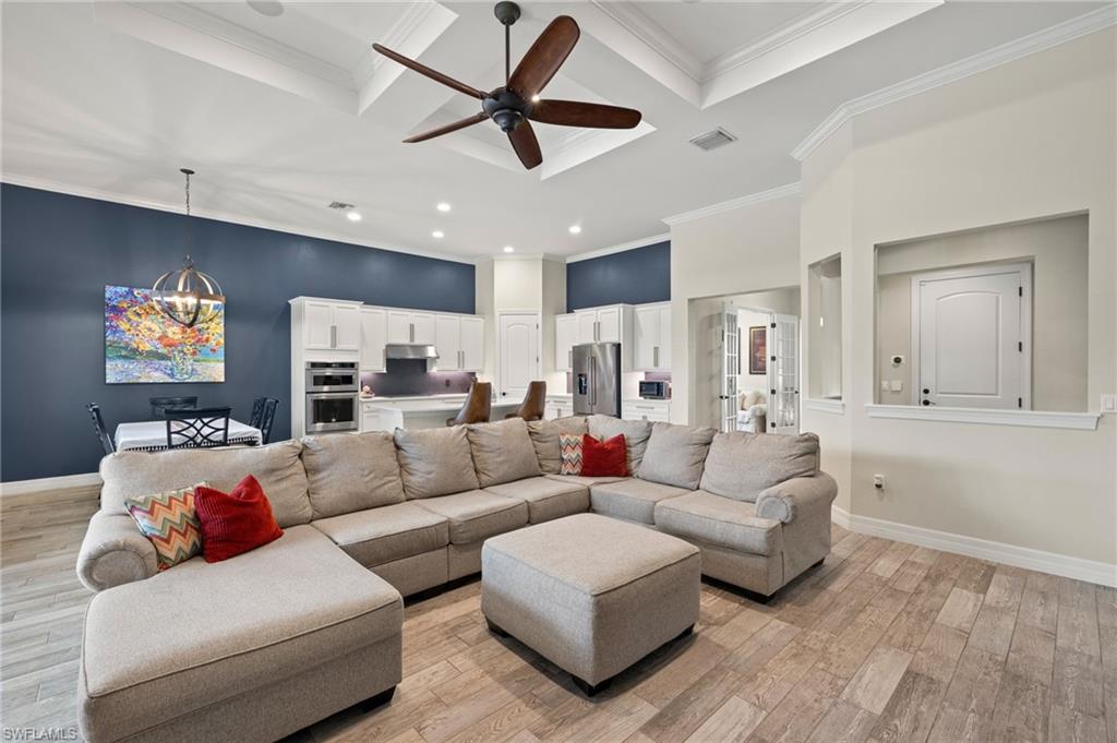 4424 Owens Way Ave Maria, FL 34142 - Photo 5 of 28 a living room with furniture and a ceiling fan