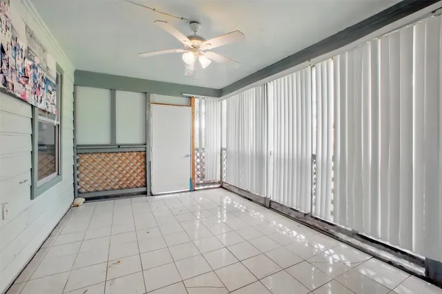 a view of a house with a backyard and a patio