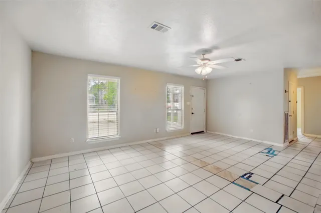 a view of an empty room and a window