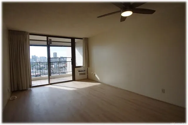 a view of an empty room with a window