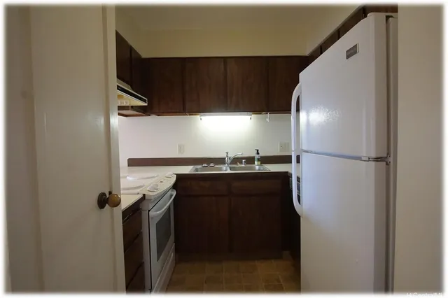 a view of storage and utility room with washer and dryer