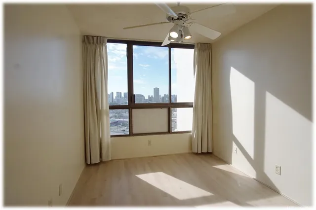 a view of an empty room with a window