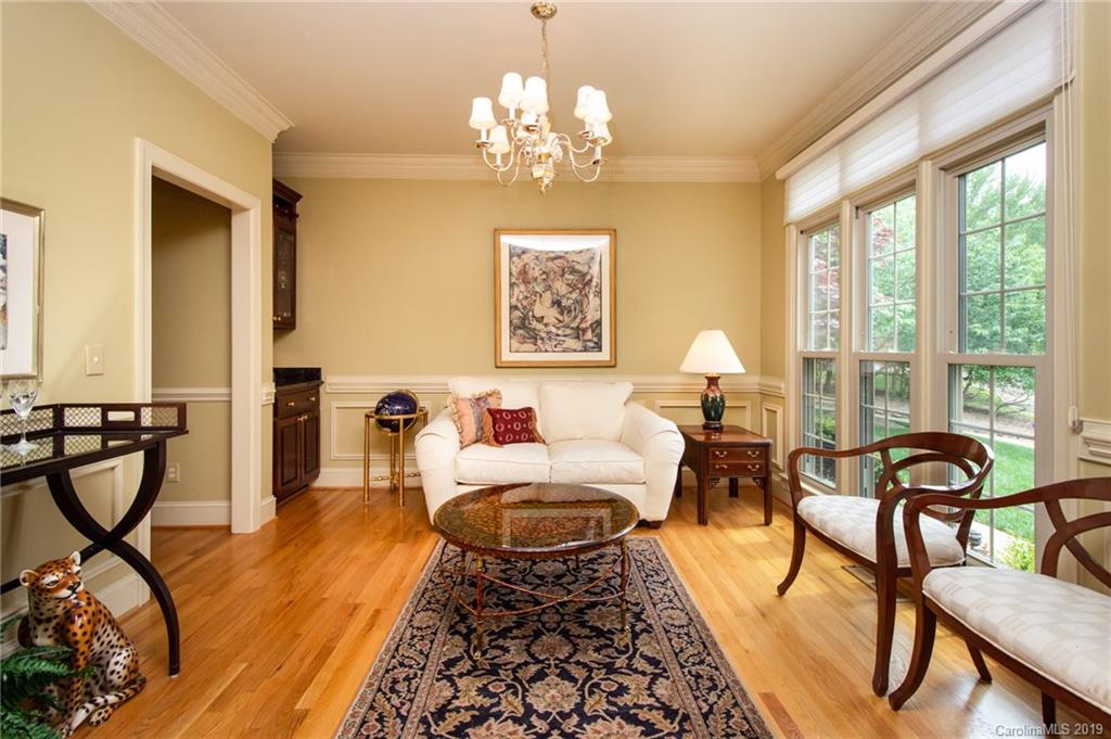 7074 Harbor Court Tega Cay, SC 29708 - Photo 5 of 36 a spacious bedroom with furniture and a chandelier