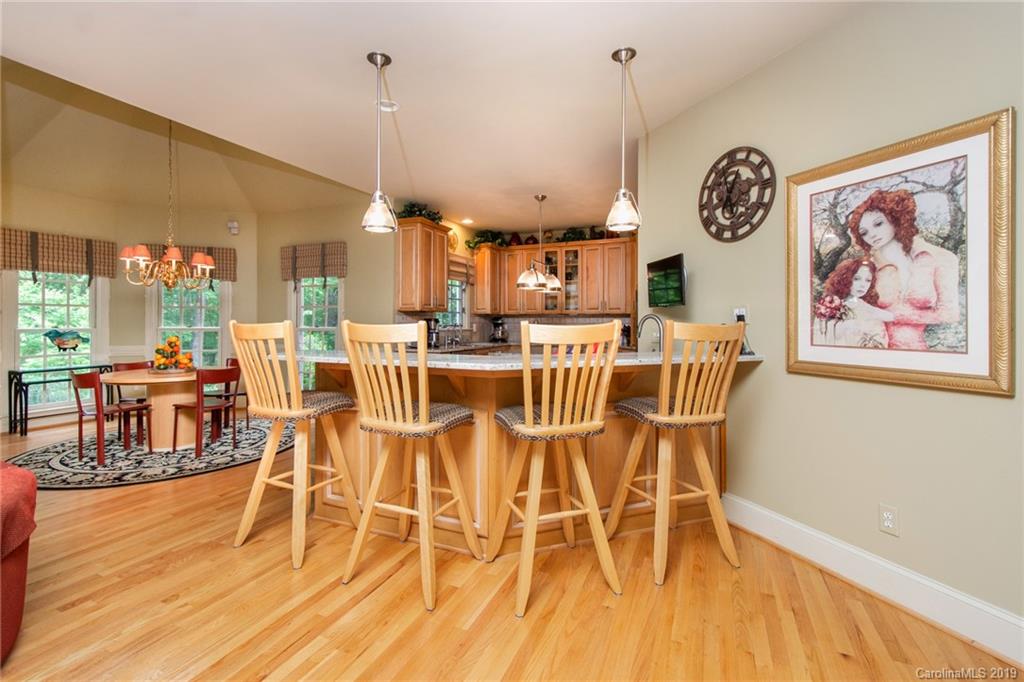7074 Harbor Court Tega Cay, SC 29708 - Photo 8 of 36 a view of a dining room with furniture window and wooden floor