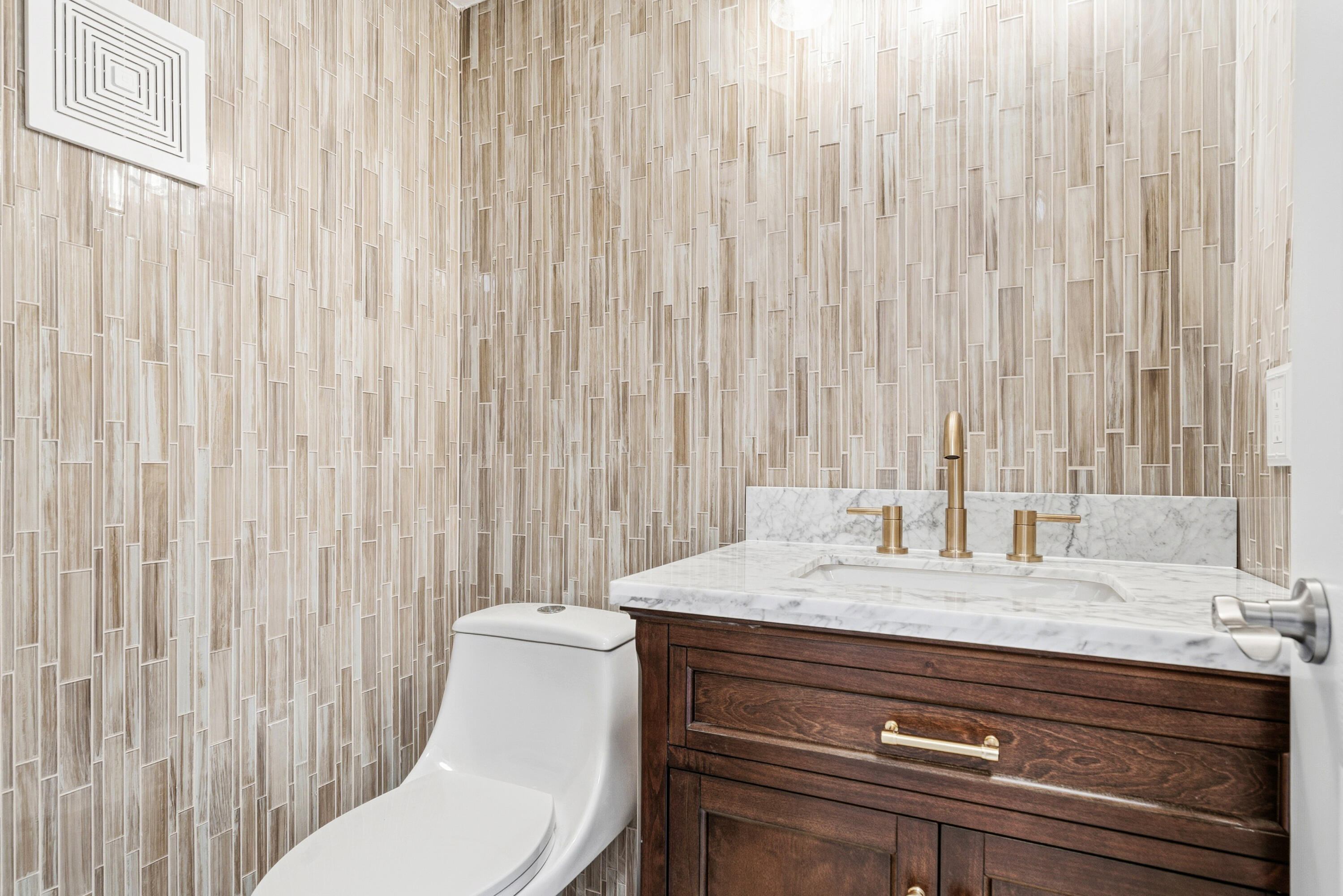 4067 Yarmouth C Boca Raton, FL 33434 - Photo 22 of 40 a bathroom with a granite countertop sink and a mirror