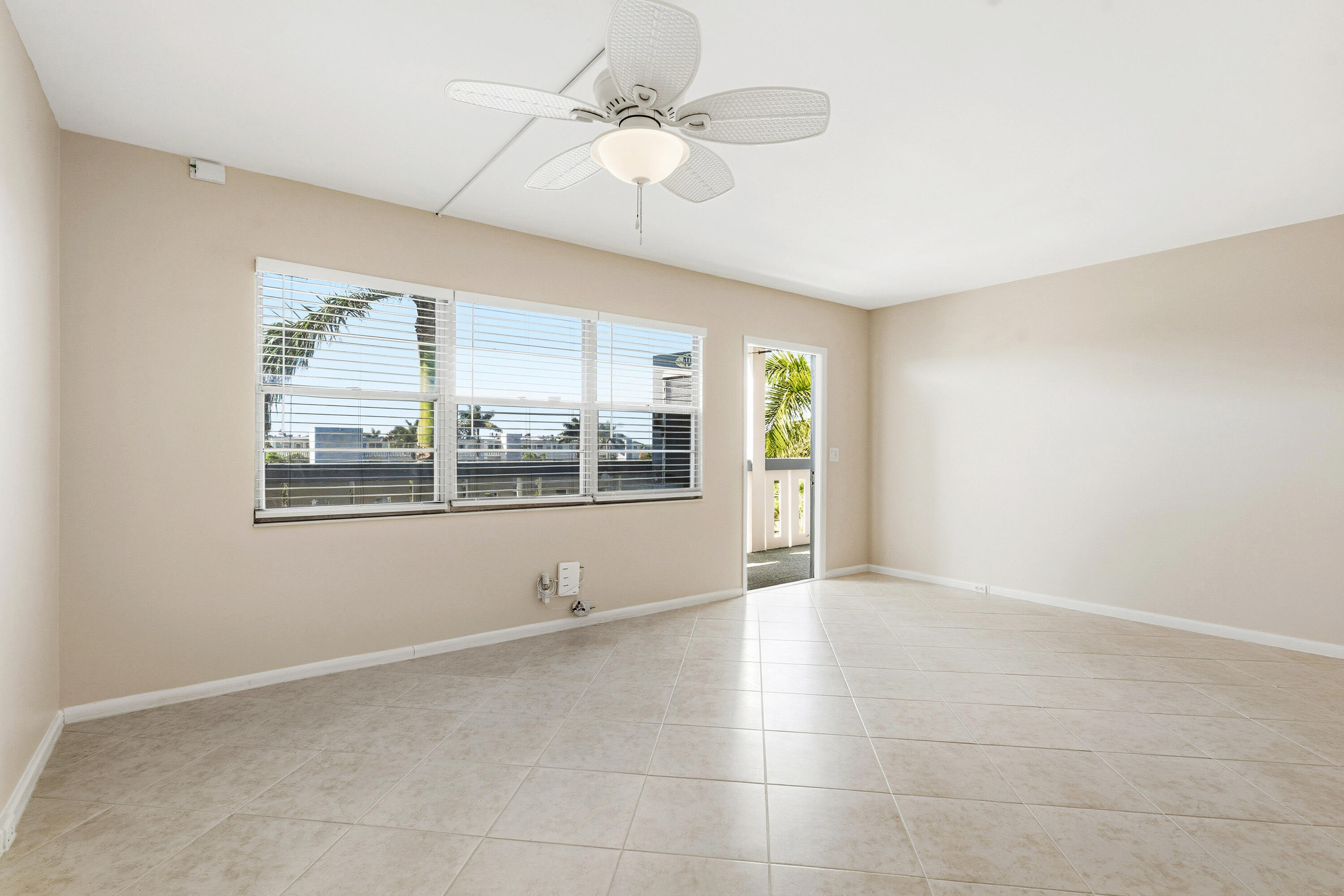 4067 Yarmouth C Boca Raton, FL 33434 - Photo 3 of 40 a view of an empty room with a window