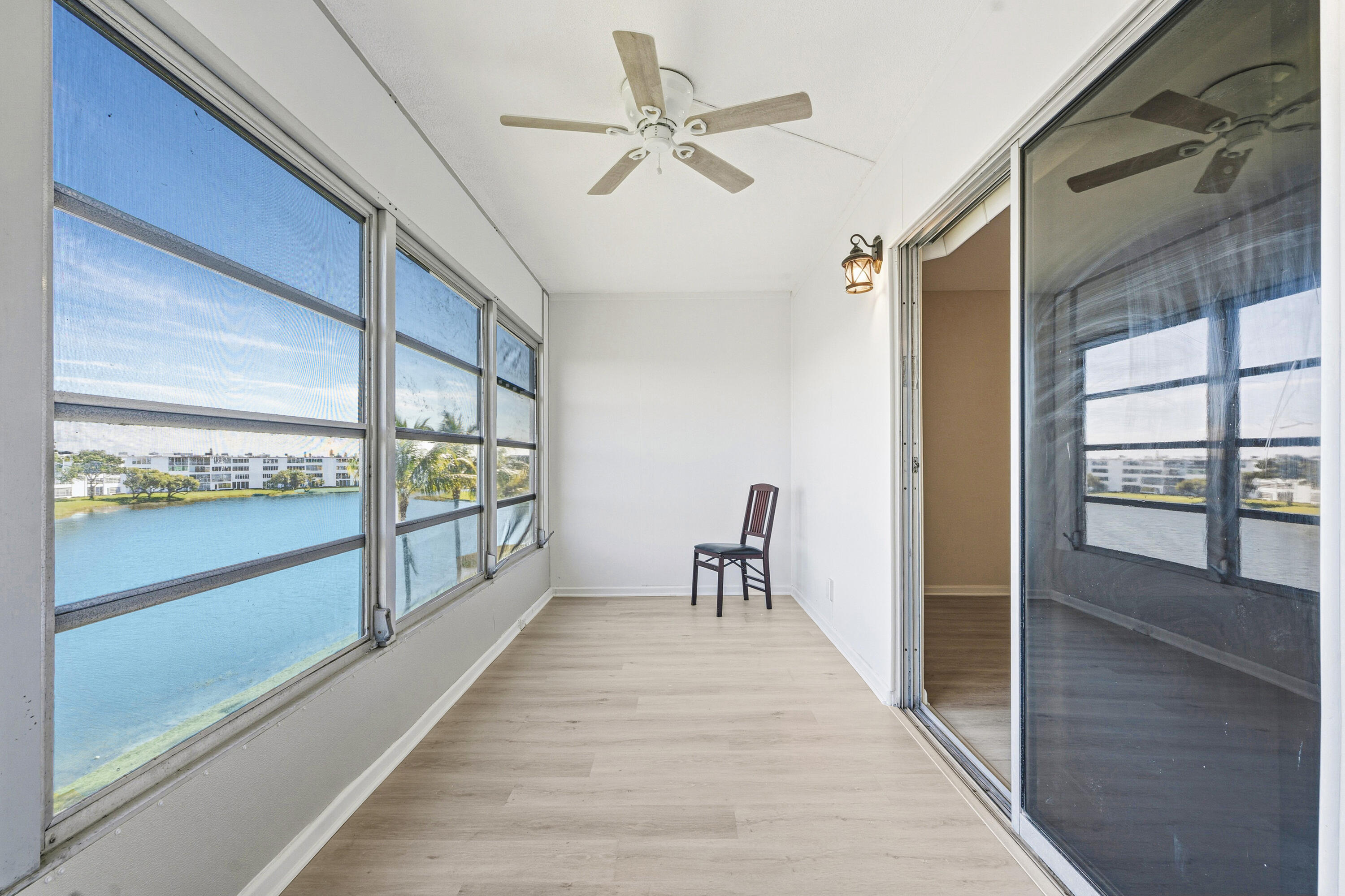 4067 Yarmouth C Boca Raton, FL 33434 - Photo 36 of 40 a view of interior space with wooden floor fan and windows