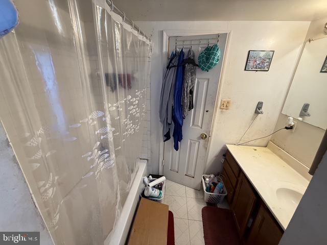 2205 Calvert Street Hyattsville, MD 20783 - Photo 13 of 26 a bathroom with a shower and a sink
