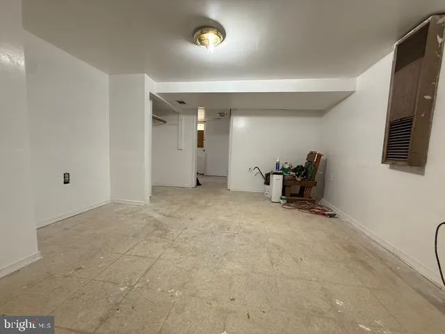 a view of a livingroom with furniture and a flat screen tv