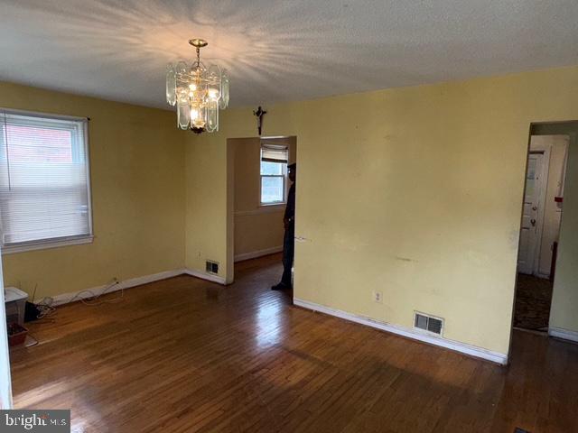 2205 Calvert Street Hyattsville, MD 20783 - Photo 3 of 26 wooden floor in an empty room with a window