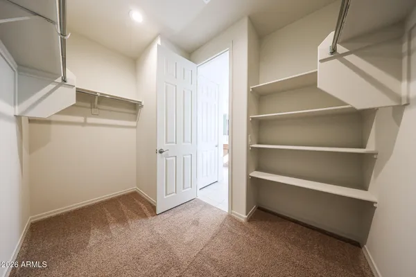 a view of an empty walk in closet