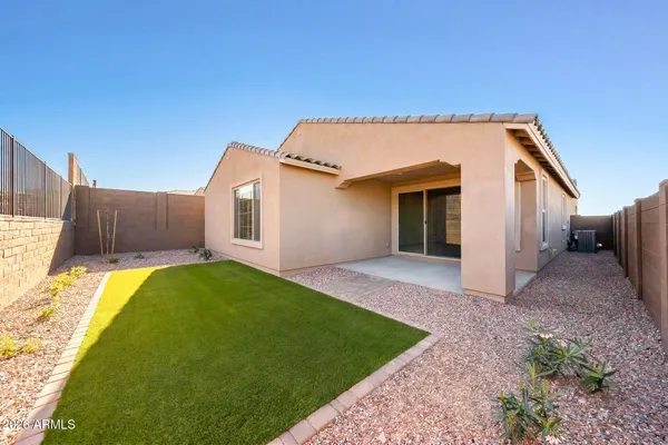 a view of a house with a backyard