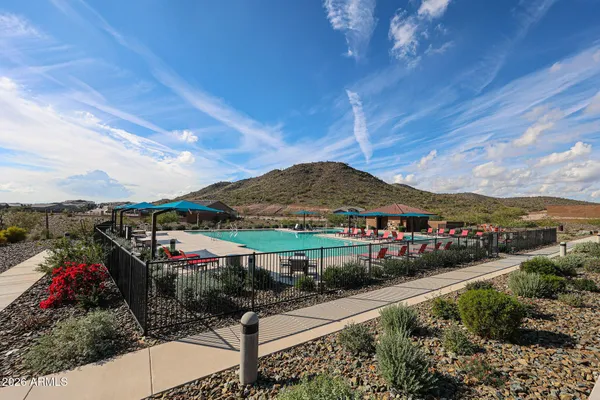 a view of a swimming pool with a patio
