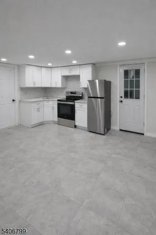 a kitchen with stainless steel appliances a refrigerator and a sink