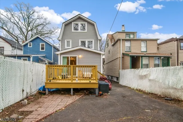 a view of a house with a yard and balcony