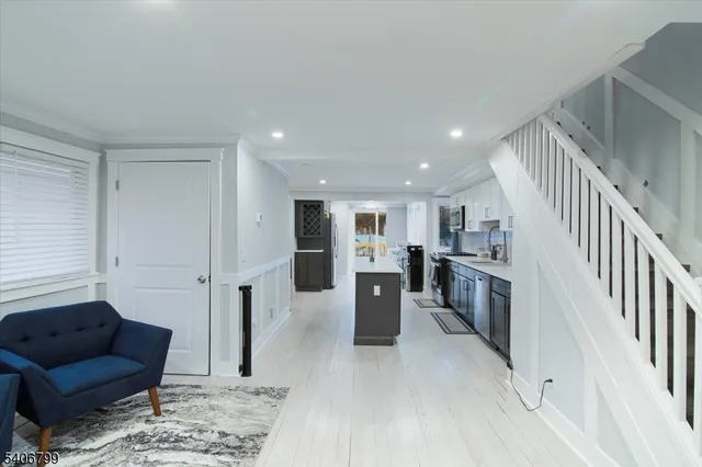 a living room with furniture and a rug