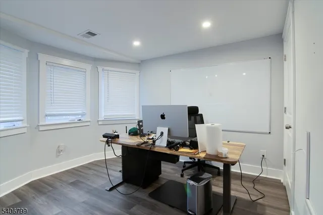 a workspace with furniture and window