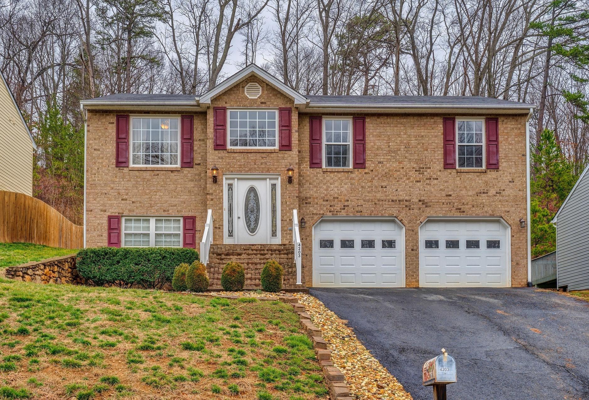 4203 Daugherty Road Salem, VA 24153 - Photo 1 of 35 a front view of a house with a yard and garage