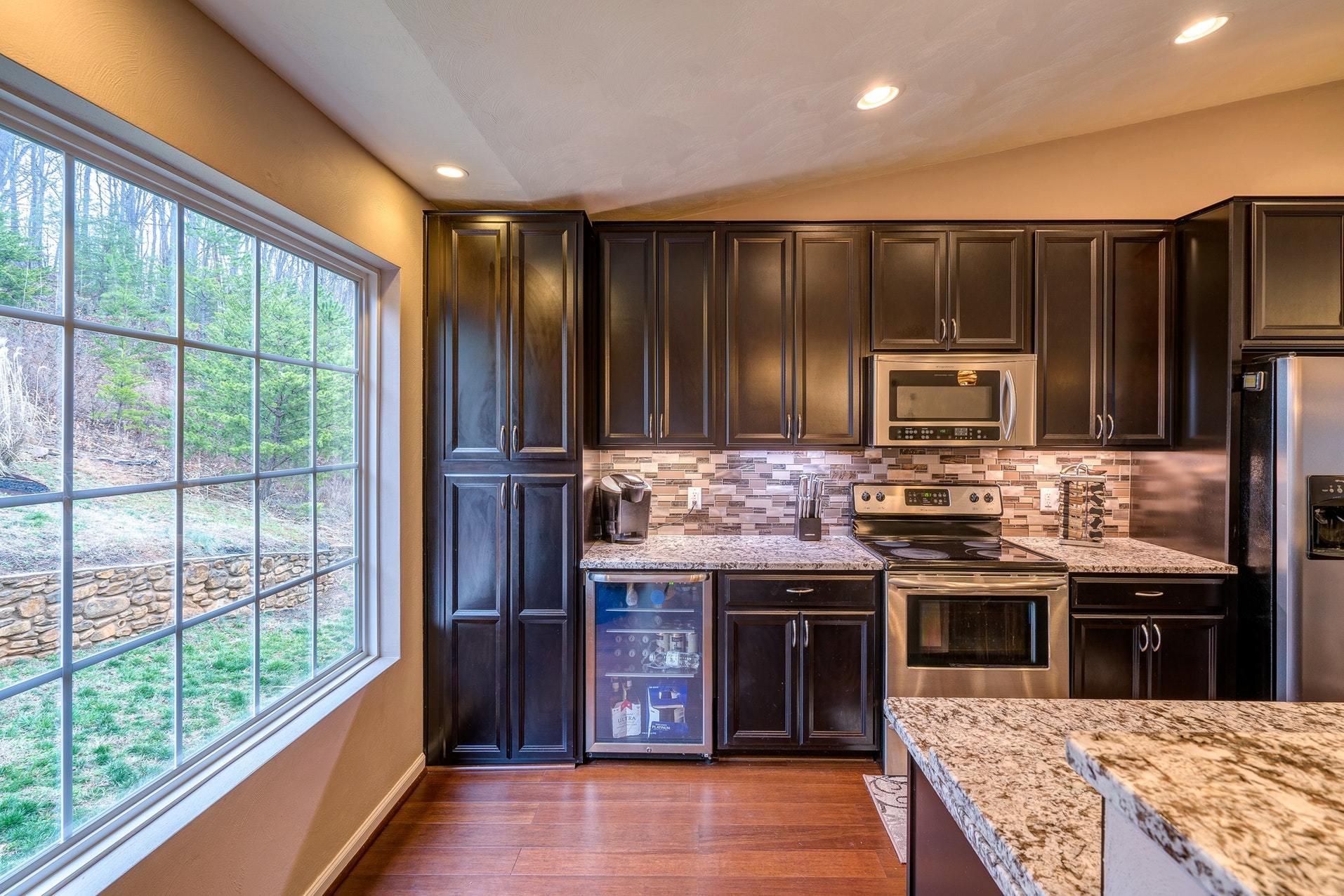4203 Daugherty Road Salem, VA 24153 - Photo 11 of 35 a kitchen with stainless steel appliances granite countertop a stove and a refrigerator