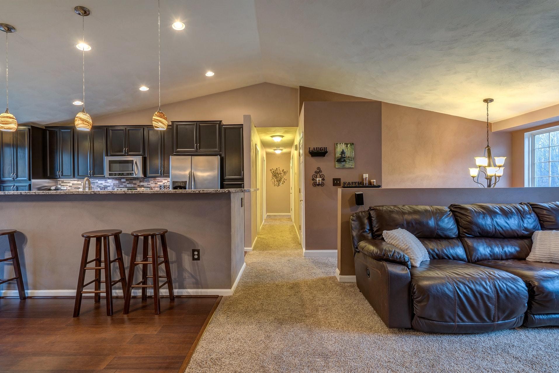 4203 Daugherty Road Salem, VA 24153 - Photo 6 of 35 a kitchen with stainless steel appliances granite countertop a refrigerator a sink a stove and a dining table with wooden floor