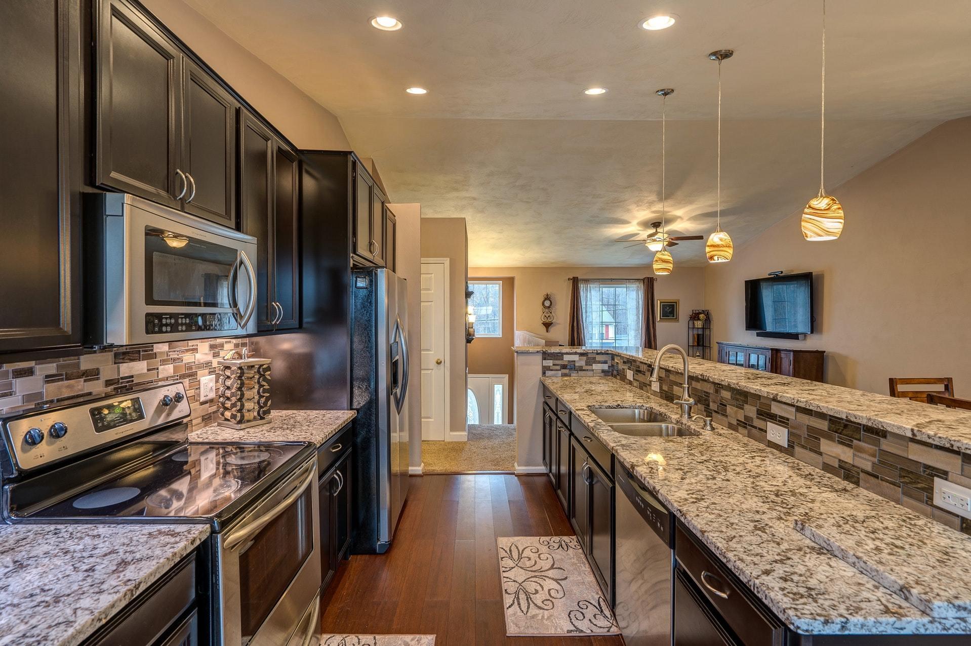 4203 Daugherty Road Salem, VA 24153 - Photo 9 of 35 a kitchen with stainless steel appliances granite countertop a stove and a sink