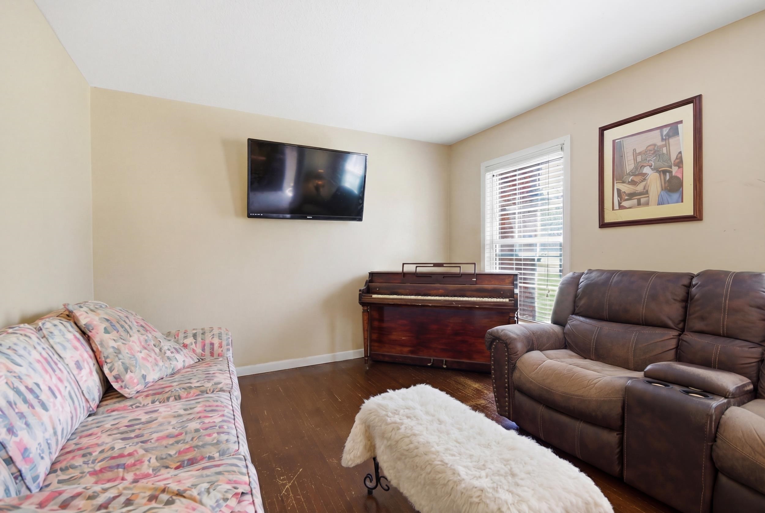 5542 Knight Arnold Road Memphis, TN 38115 - Photo 3 of 17 Living area with wood finished floors and baseboards