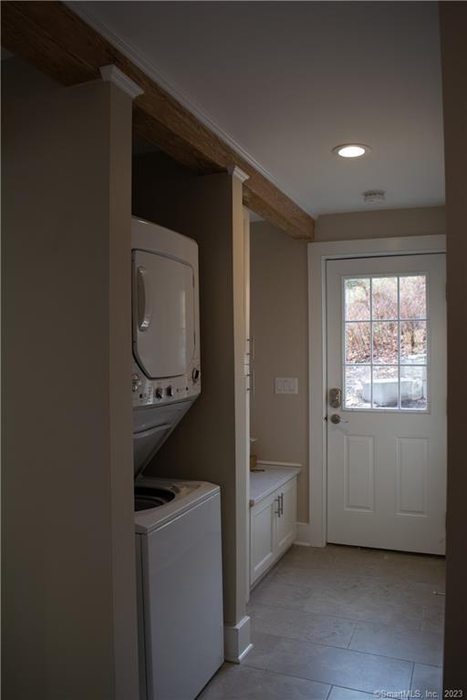 8 West Main Street Chester, CT 06412 - Photo 15 of 21 Upon entering the unit from the parking area, you will find a cubby for coats, bags and shoes and a stackable washer/dryer.