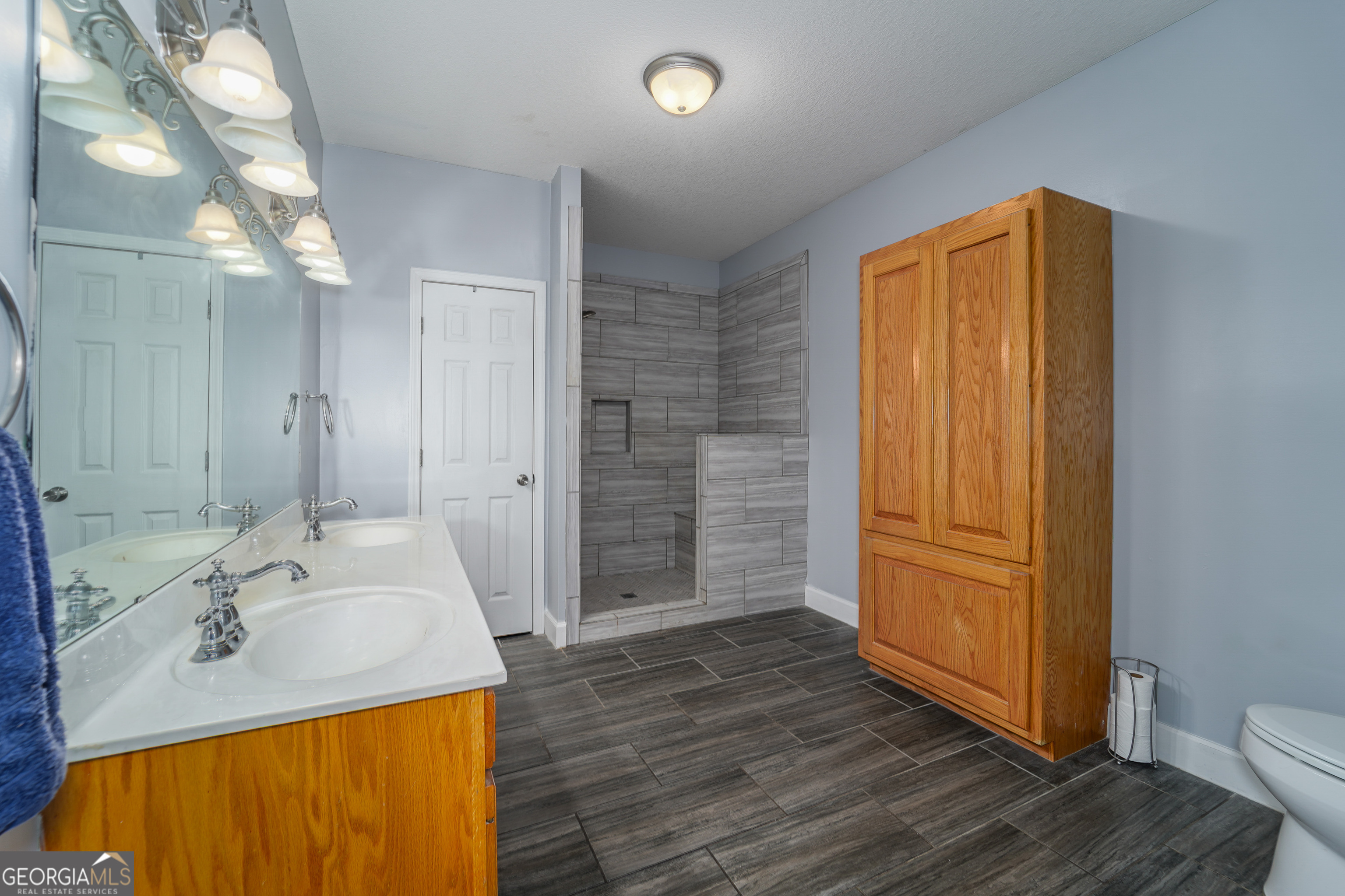 3300 Connor Lane Waycross, GA 31503 - Photo 31 of 42 a bathroom with a sink a toilet and shower