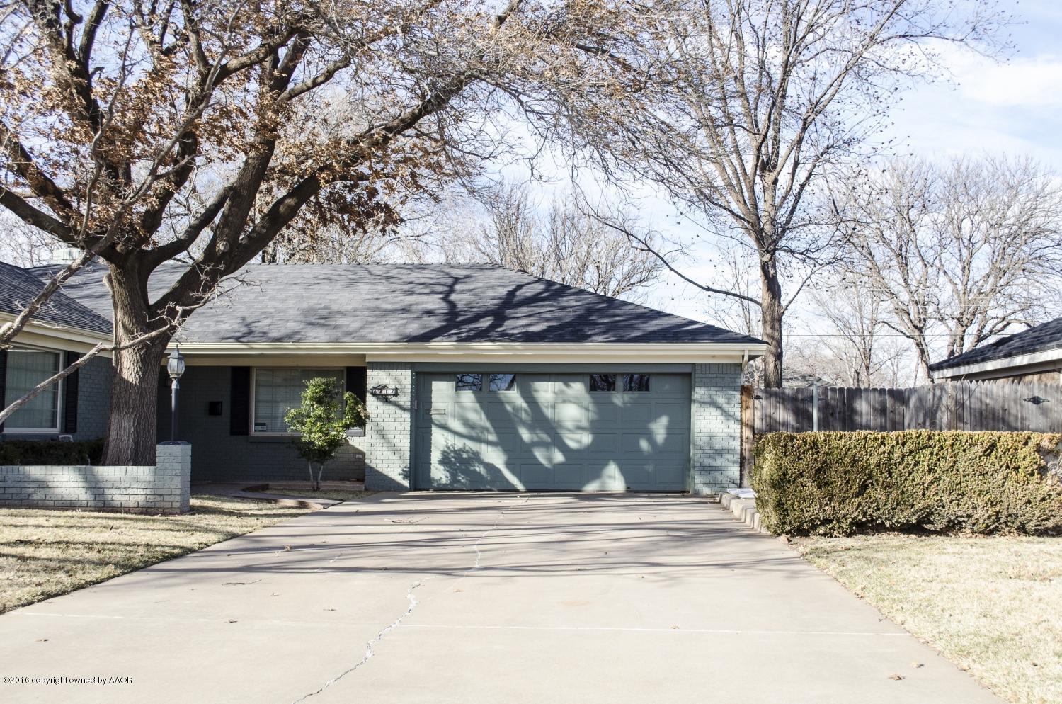6312 Elmhurst Road Amarillo, TX 79106 - Photo 2 of 85 a front view of a house with a garden