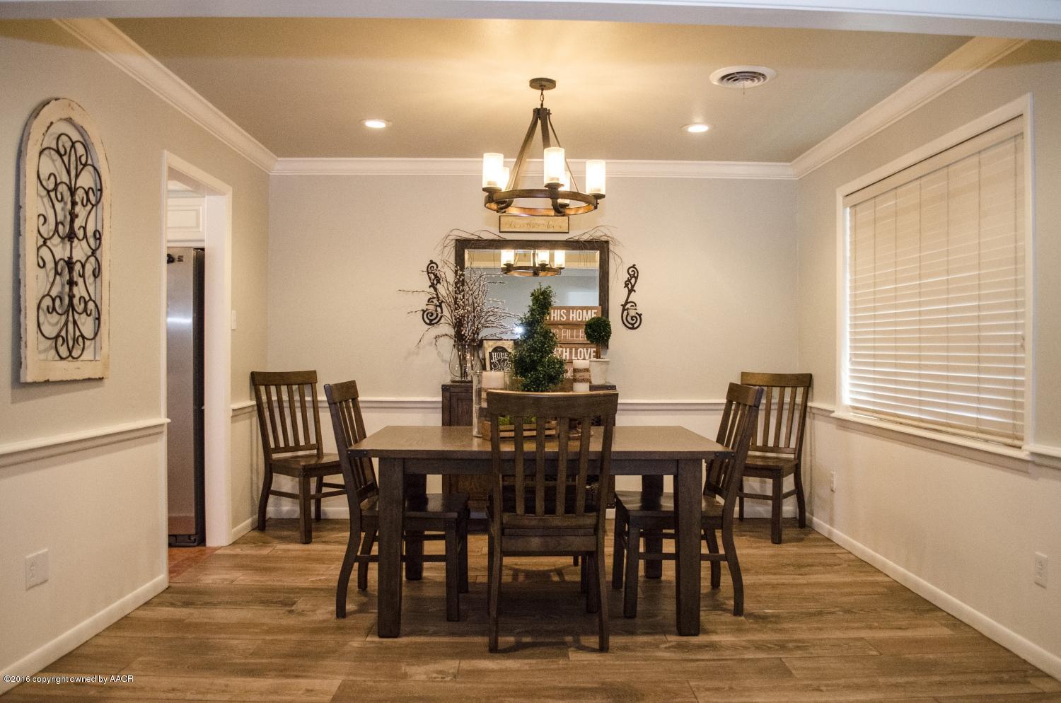 6312 Elmhurst Road Amarillo, TX 79106 - Photo 28 of 85 a view of a dining room with furniture window and wooden floor