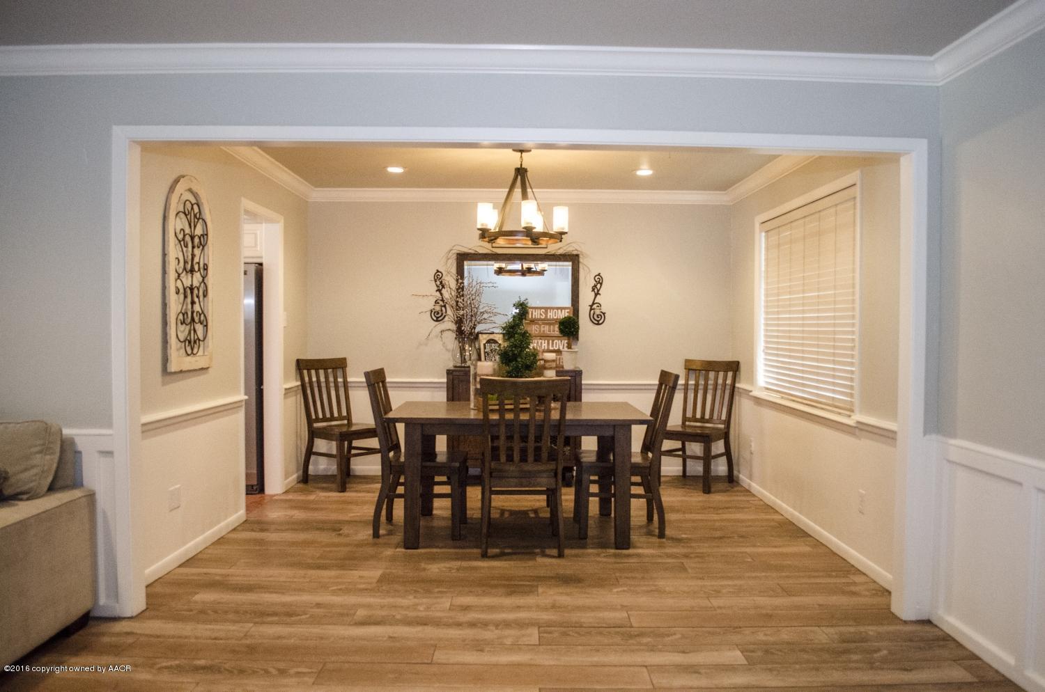 6312 Elmhurst Road Amarillo, TX 79106 - Photo 29 of 85 a view of a dining room with furniture window and wooden floor