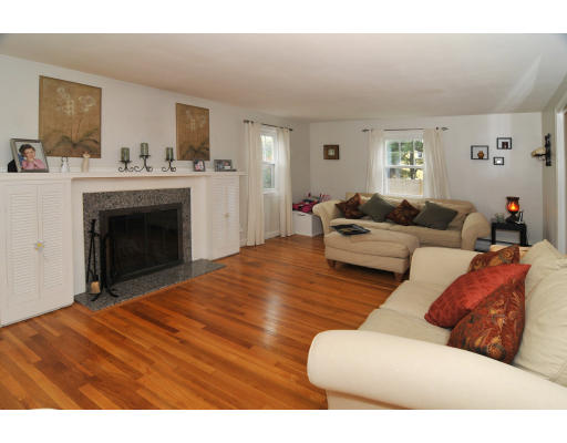 2 Northgate Road Chelmsford, MA 01824 - Photo 3 of 10 a living room with furniture and a fireplace