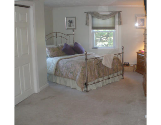 2 Northgate Road Chelmsford, MA 01824 - Photo 6 of 10 a bedroom with a bed and a window