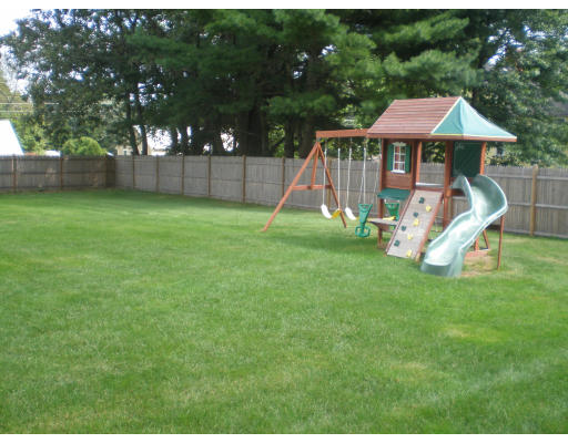 2 Northgate Road Chelmsford, MA 01824 - Photo 8 of 10 a view of a house with a backyard and a slide