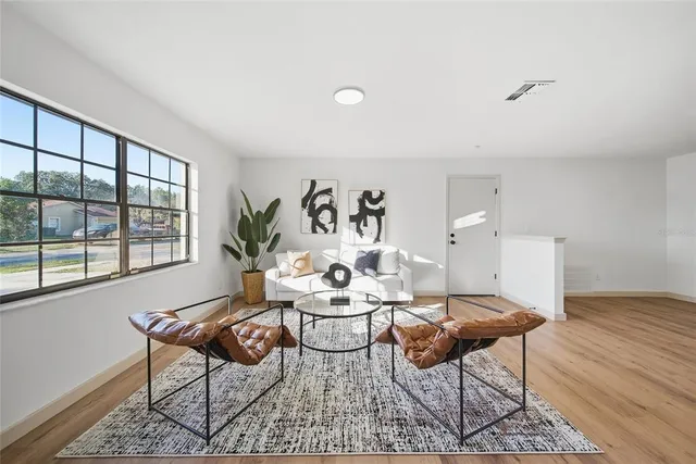 a living room with furniture and a window