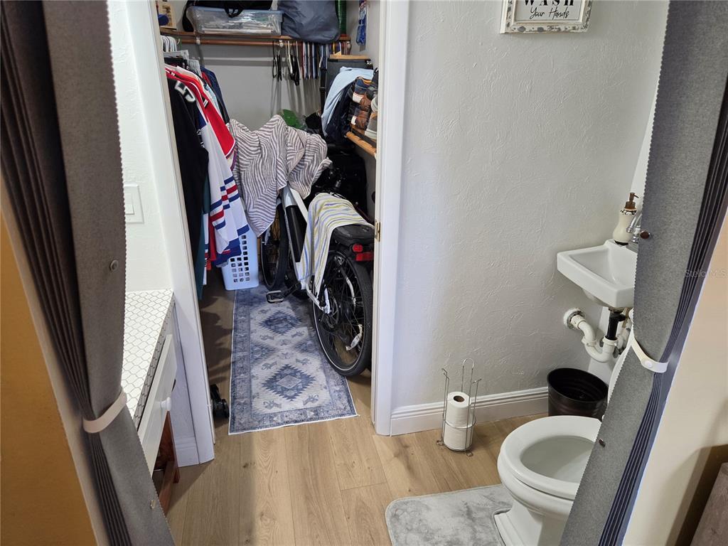 7 Dunoon Place, Unit 309 Dunedin, FL 34698 - Photo 22 of 25 a view of walk in closet with clothes and shoes