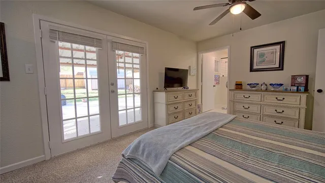 a bed room with a bed and a television